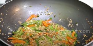 adding capsicum in pan for manchurian recipe 