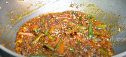 adding sauces in pan for Manchurian recipe 