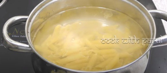 cooking penne pasta in boiling water for white sauce pasta recipe 