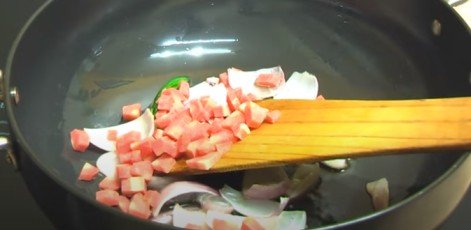 adding chopped carrot in pan for chilli paneer recipe 