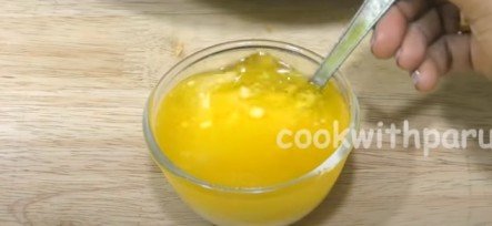 mixing ghee and hot milk for mohanthal recipe 