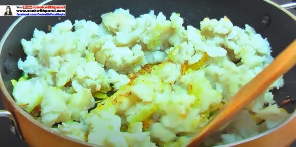 mixing potato with masala for masala dosa recipe 
