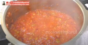 mashing vegetable in a cooker for pav bhaji recipe 