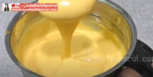 churning mango ice cream in a jar for mango ice cream recipe 